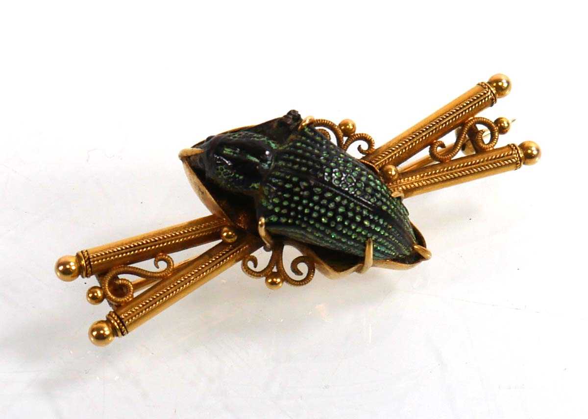 Lot 912 - An early 20th century yellow metal brooch...