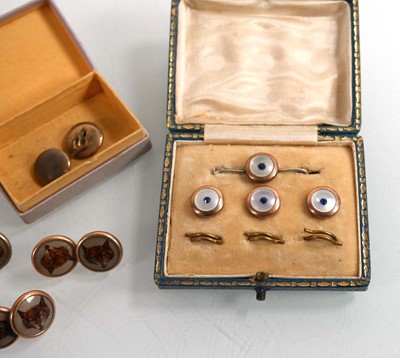 Lot 914 - Six git metal dress studs, each decorated with...