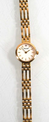 Lot 433 - A ladies 9ct yellow gold wristwatch by...