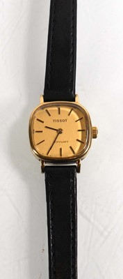 Lot 443 - A ladies 9ct yellow gold wristwatch by Tissot,...