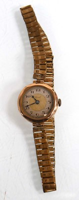 Lot 443 - A ladies 9ct yellow gold wristwatch by Tissot,...