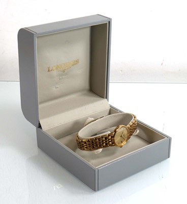 Lot 445 - A ladies gold plated wristwatch by Longines,...