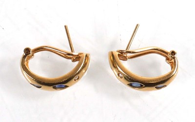 Lot 922 - A pair of 14ct yellow gold ear hoops, each set...