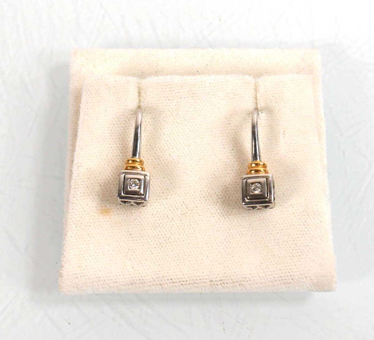 Lot 923 - A pair of 18ct white and yellow gold...