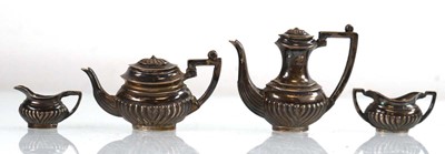 Lot 219 - A miniature harlequin four piece silver tea...