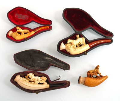 Lot 119 - A group of four 19th century meerschaum, amber...