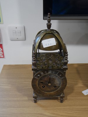 Lot 1055 - Ornate brass clock