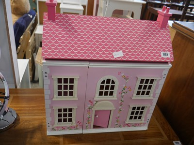 Lot 1102 - A pink dolls house