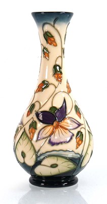 Lot 165 - A small Moorcroft bottle vase decorated in the...