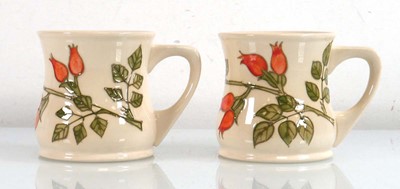 Lot 169 - A pair of Moorcroft mugs, each decorated in...