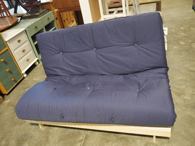 Lot 1116 - Modern pine double futon with navy cushion