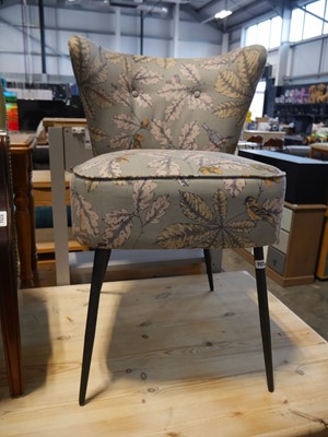 Lot 1122 - Floral upholstered cocktail chair bearing...