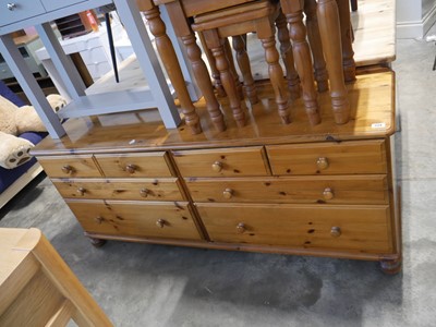 Lot 1124 - Pine low boy with and arrangement of 8 drawers