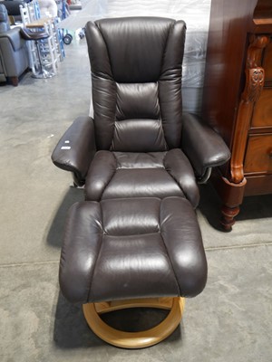 Lot 1173 - Wooden framed swivel brown leather upholstered...