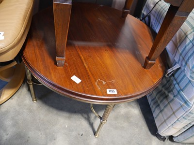 Lot 1135 - Mahogany effect circular coffee table on brass...