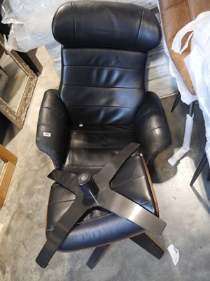 Lot 1202 - Eames type black leatherette upholstered easy...