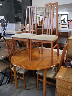 Lot 1148 - Circular dining table in teak effect finish...