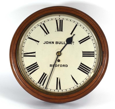 Lot 130 - A circular wall clock retailed by John Bull of...