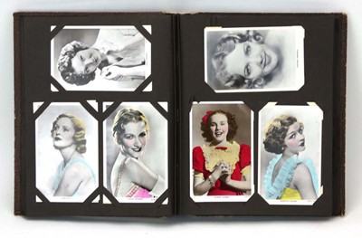 Lot 138 - An album of glamorous photographic postcards...