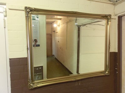 Lot 14 - A large ornate gilt framed bevel glass mirror