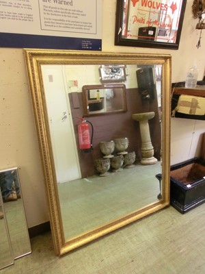 Lot 18 - A large ornate gilt framed bevel glass mirror