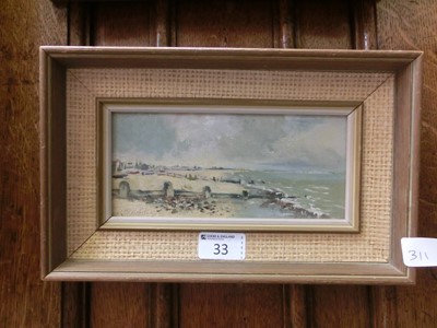 Lot 33 - A framed oil on board of beach scene signed...