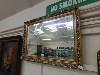 Lot 63 - A gilt framed rectangular bevel glass mirror