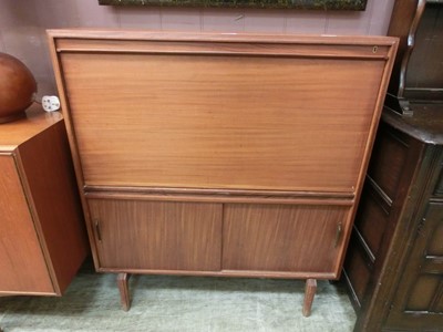 Lot 77 - A mid-20th century cabinet having pull down...