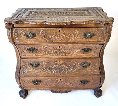 Lot 11 - An oak bombe chest, the four long graduated...