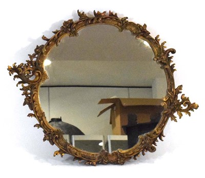Lot 9 - A 19th century giltwood mirror, the circular...