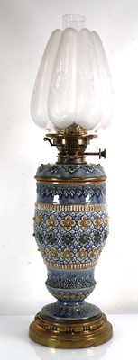 Lot 208 - A Royal Doulton oil lamp decorated with...