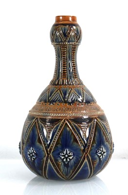 Lot 211 - A Doulton Lambeth bottle vase of squat form...