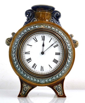 Lot 215 - A Doulton Lambeth timepiece/clock, the white...