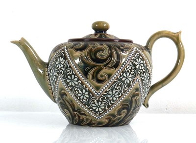 Lot 219 - A Doulton Lambeth teapot decorated with...