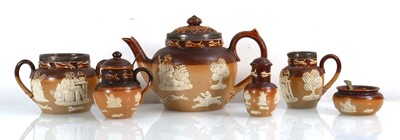 Lot 223 - A Doulton Lambeth harvest ware three piece tea...