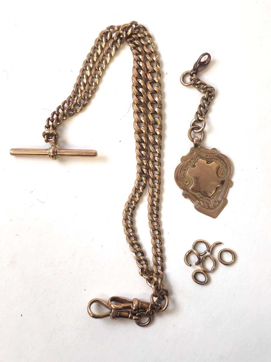 Lot 431 - A 9ct rose gold double albert chain with...