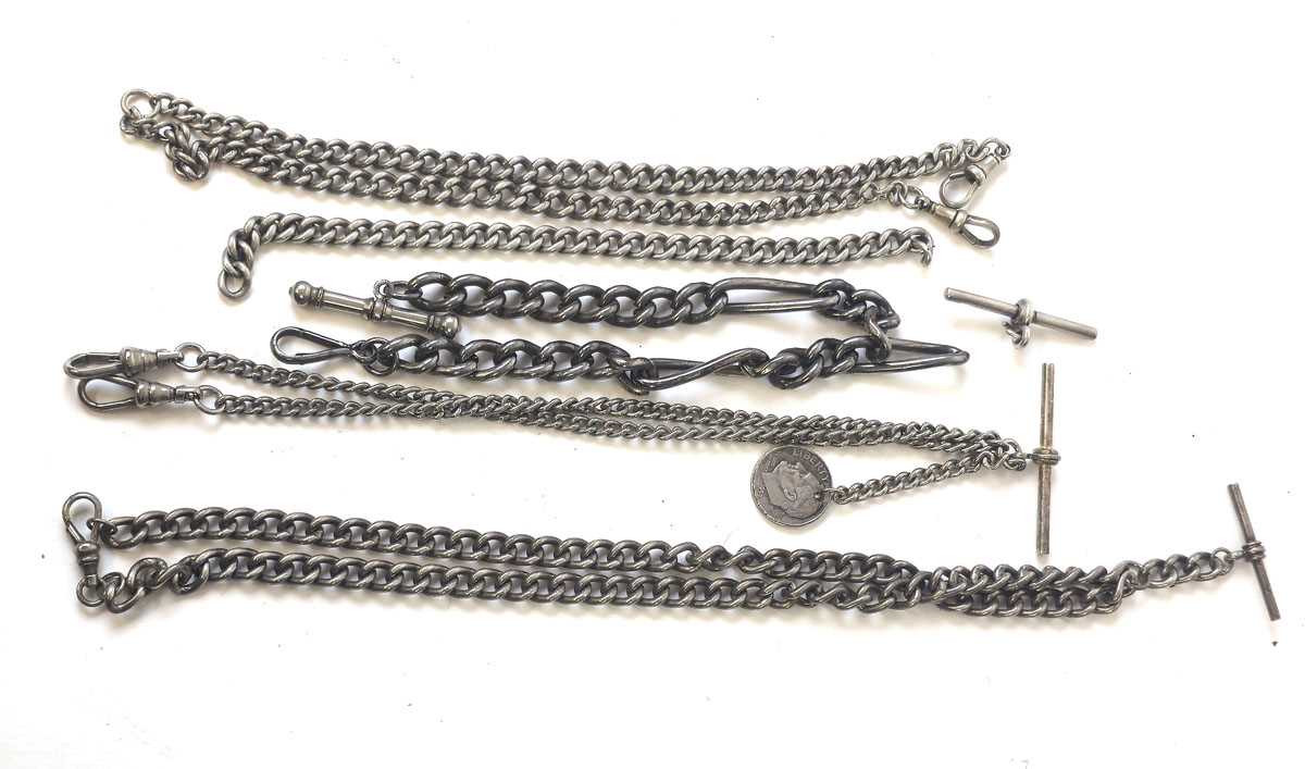 Lot 445 - A collection of silver and white metal albert...