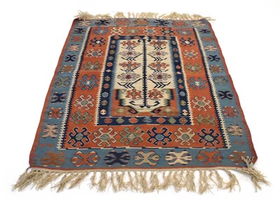 Lot 12 - A Central Asian kilim decorated with fertility...