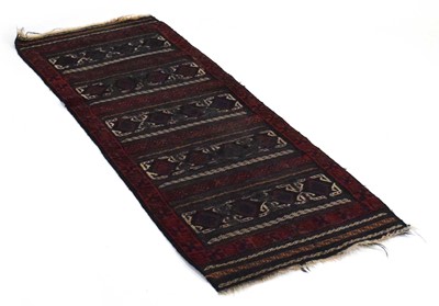 Lot 13 - A Persian woollen runner decorated with five...