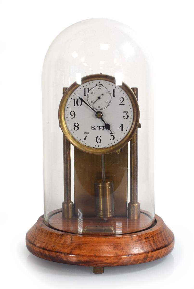 Lot 35 - An American electric clock by Barr under a...