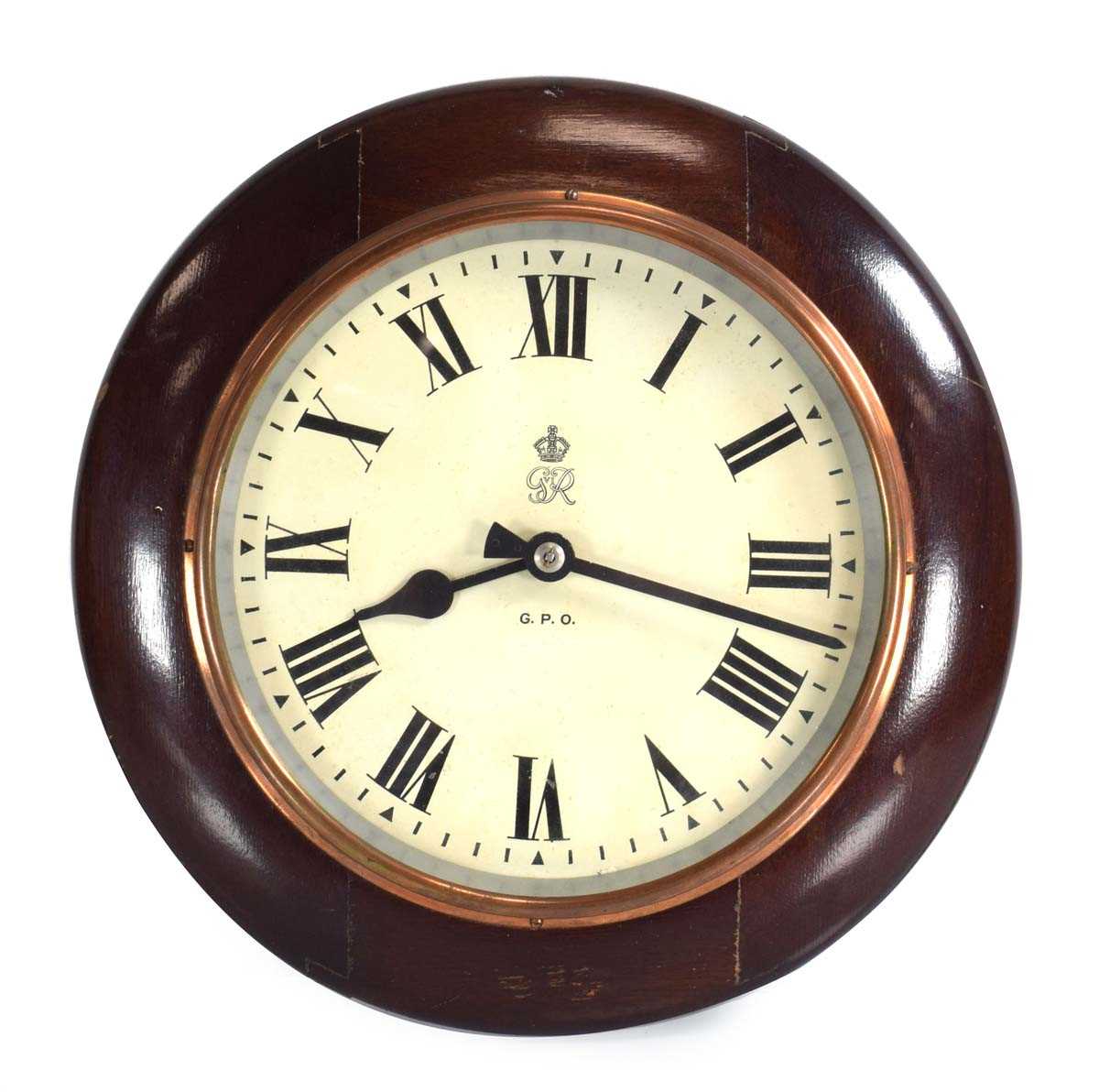 Lot 45 - A circular electric wall clock with a...