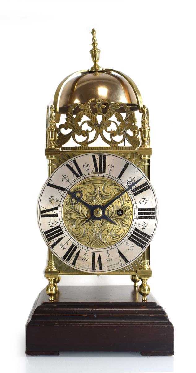 Lot 79 - An early 20th century brass lantern clock with...