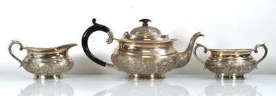 Lot 305 - An Anglo Indian metalware three piece tea...