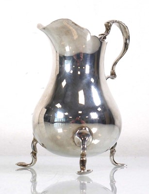 Lot 311 - A late Victorian silver cream jug with leaf...