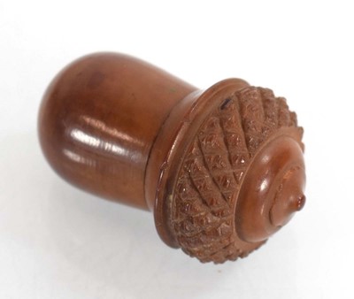 Lot 100 - A coquilla nut thimble holder containing a...