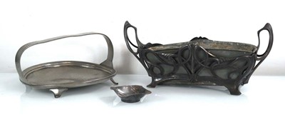 Lot 130 - A pewter two handled trough decorated in the...