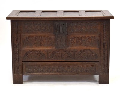 Lot 12 - An 18th century oak panelled mule chest, the...