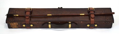 Lot 149 - A leather and brass mounted gun case for a 12...