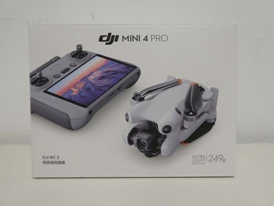 Lot DJI Mini 4 Pro drone, boxed with remote...