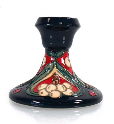 Lot 311 - A Moorcroft candlestick decorated in the...